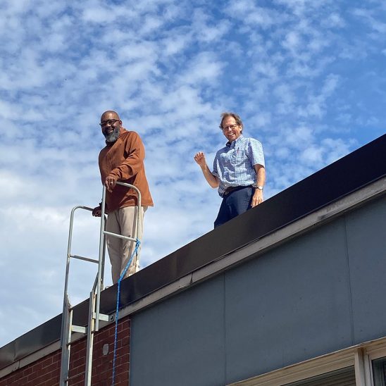 Guys on the roof: Zac Price and John Duke at St. John Evangelist Catholic School