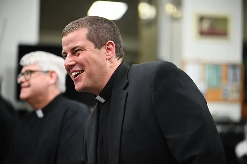 Father Robbie Cotta, chaplain of St. Pius X High School, laughs with fellow comedians before the sold out "Atlanta's Funniest Priests" show on Nov. 12 hosted by The Quest.