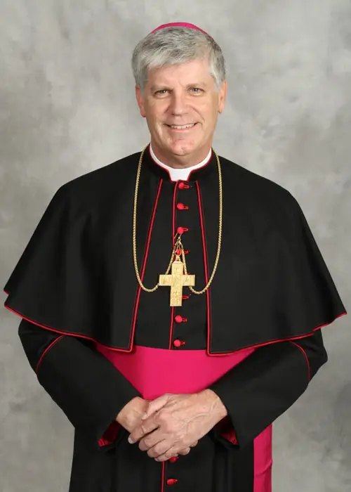 Bishop Bernard E. Shlesinger wearing a black cassock