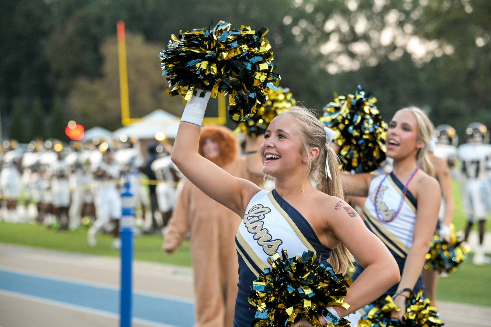 Saint Pius X Catholic High School cheerleaders participate in a fall football game.